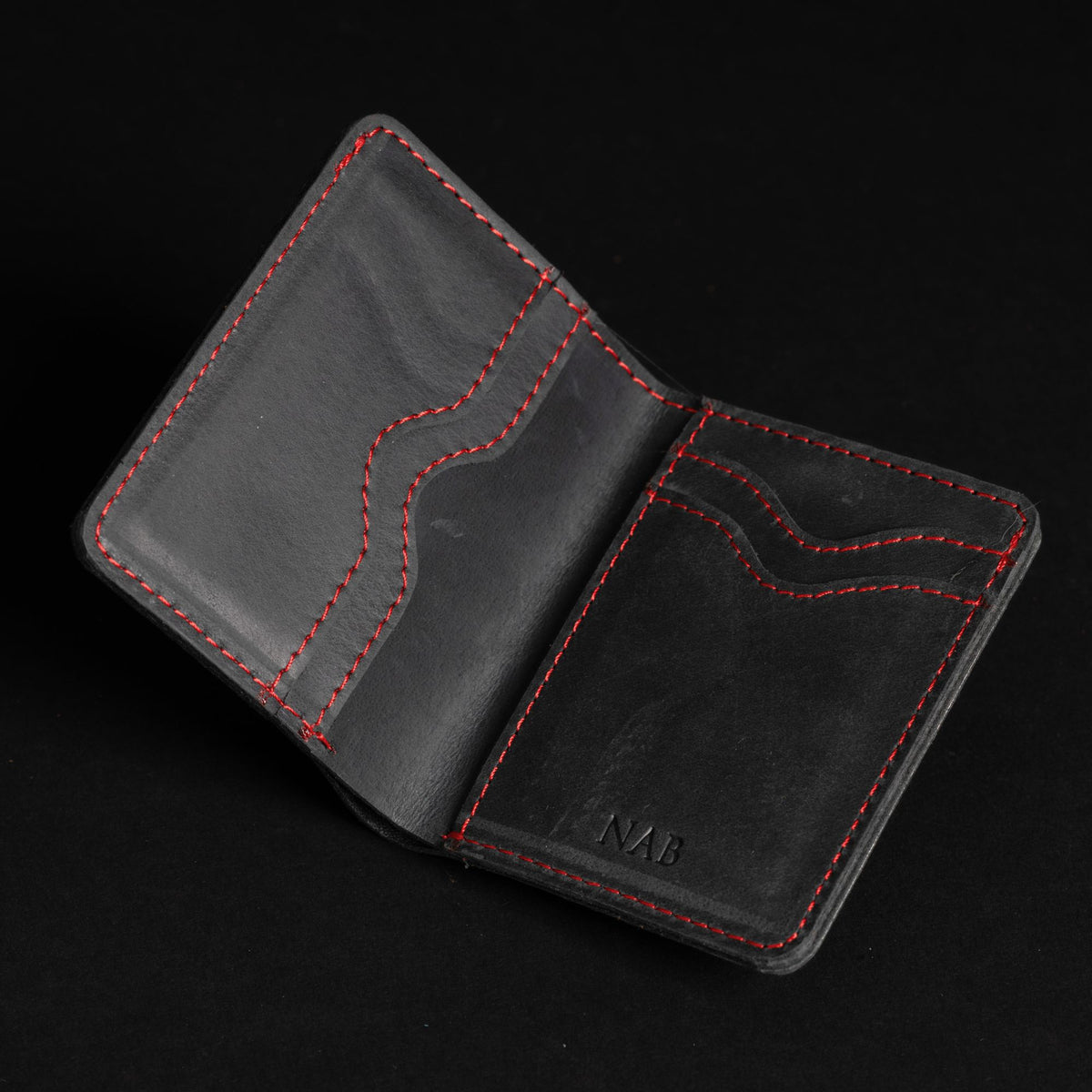 The Diablo black leather card holder with red stitching