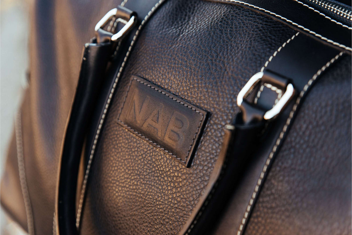 The Shield black full-grain leather duffle bag