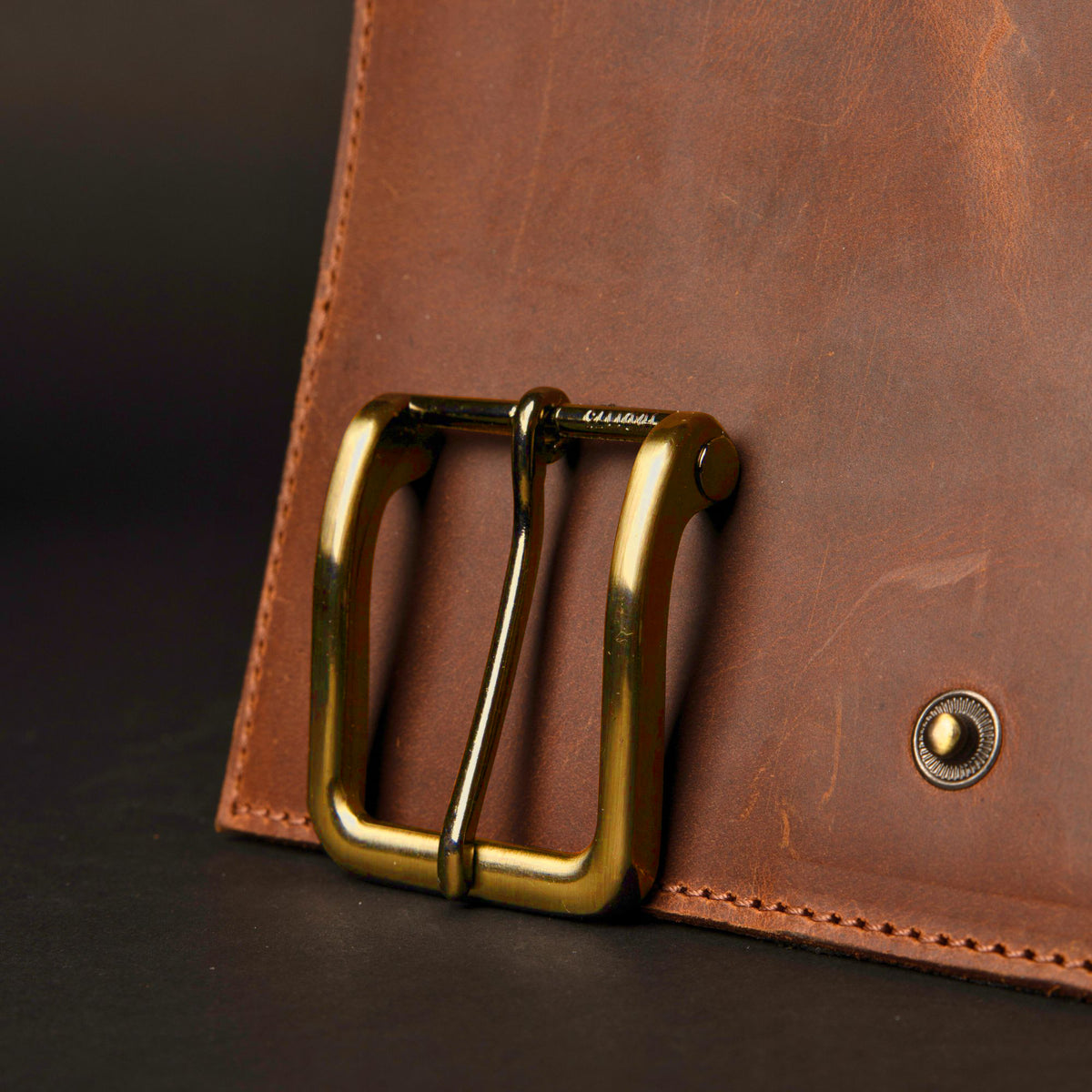 The Alchemist long semi-rounded brass belt buckle, 40 mm