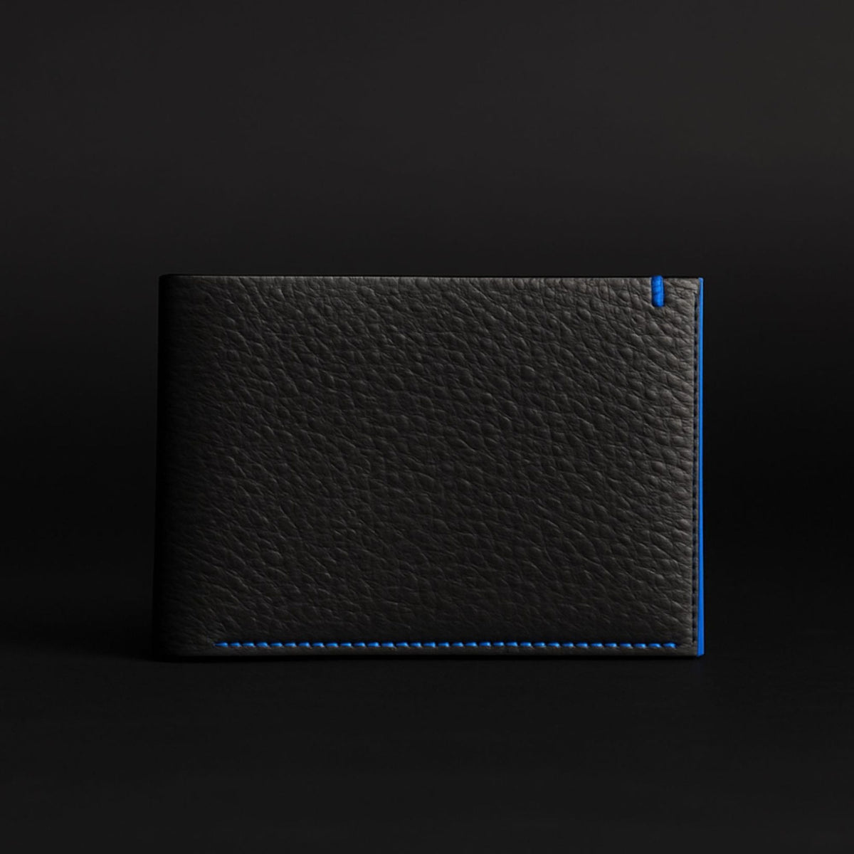 The Diablo dollar size black leather wallet with red stitching