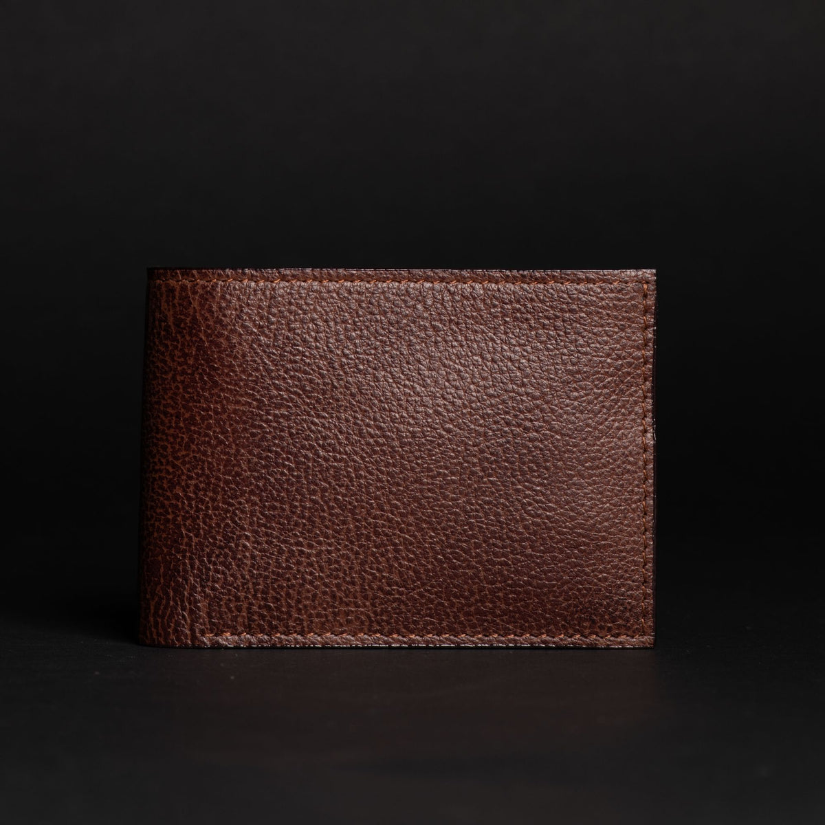 The Maverick pebble grain bison leather wallet in brown