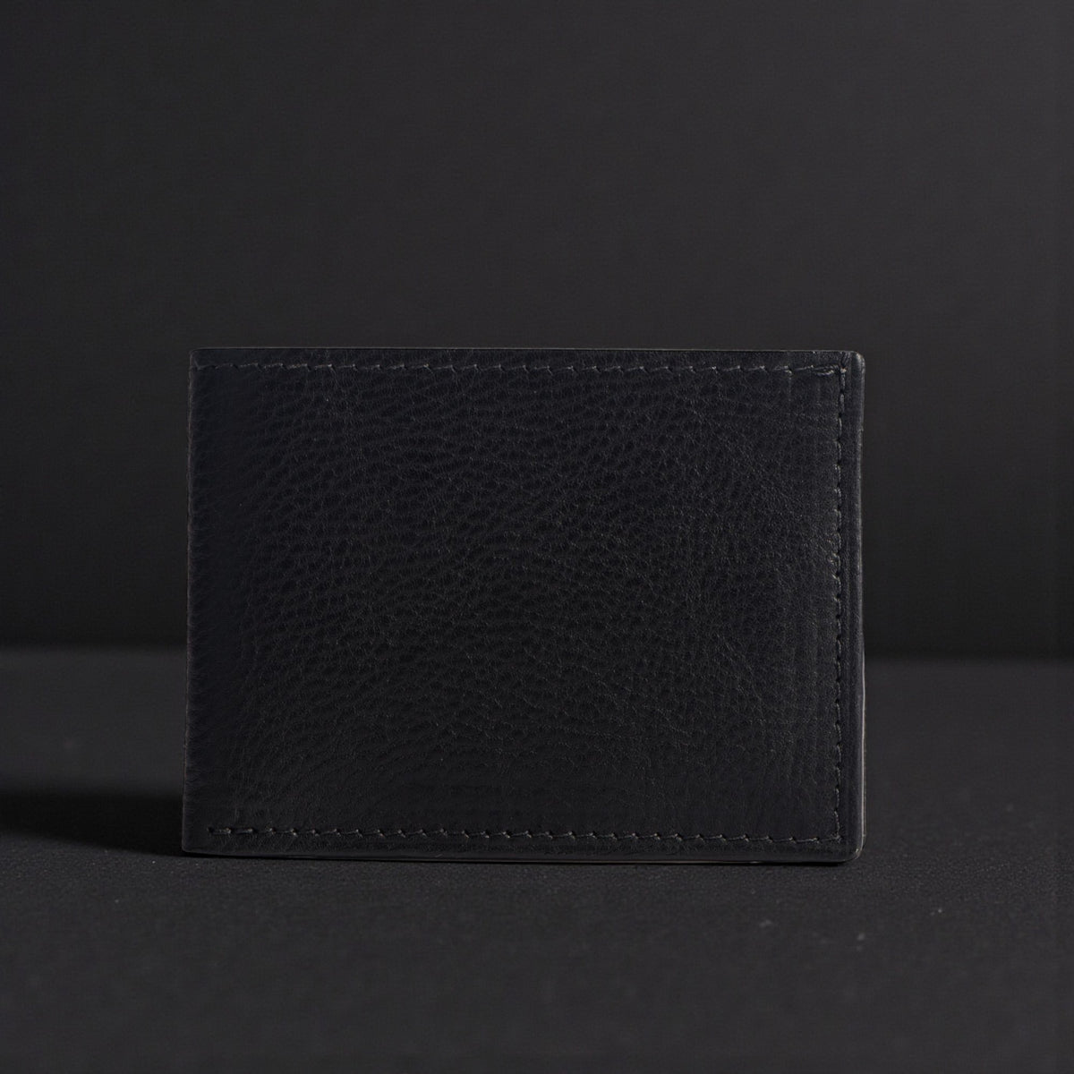 The Maverick pebble grain bison leather wallet in black