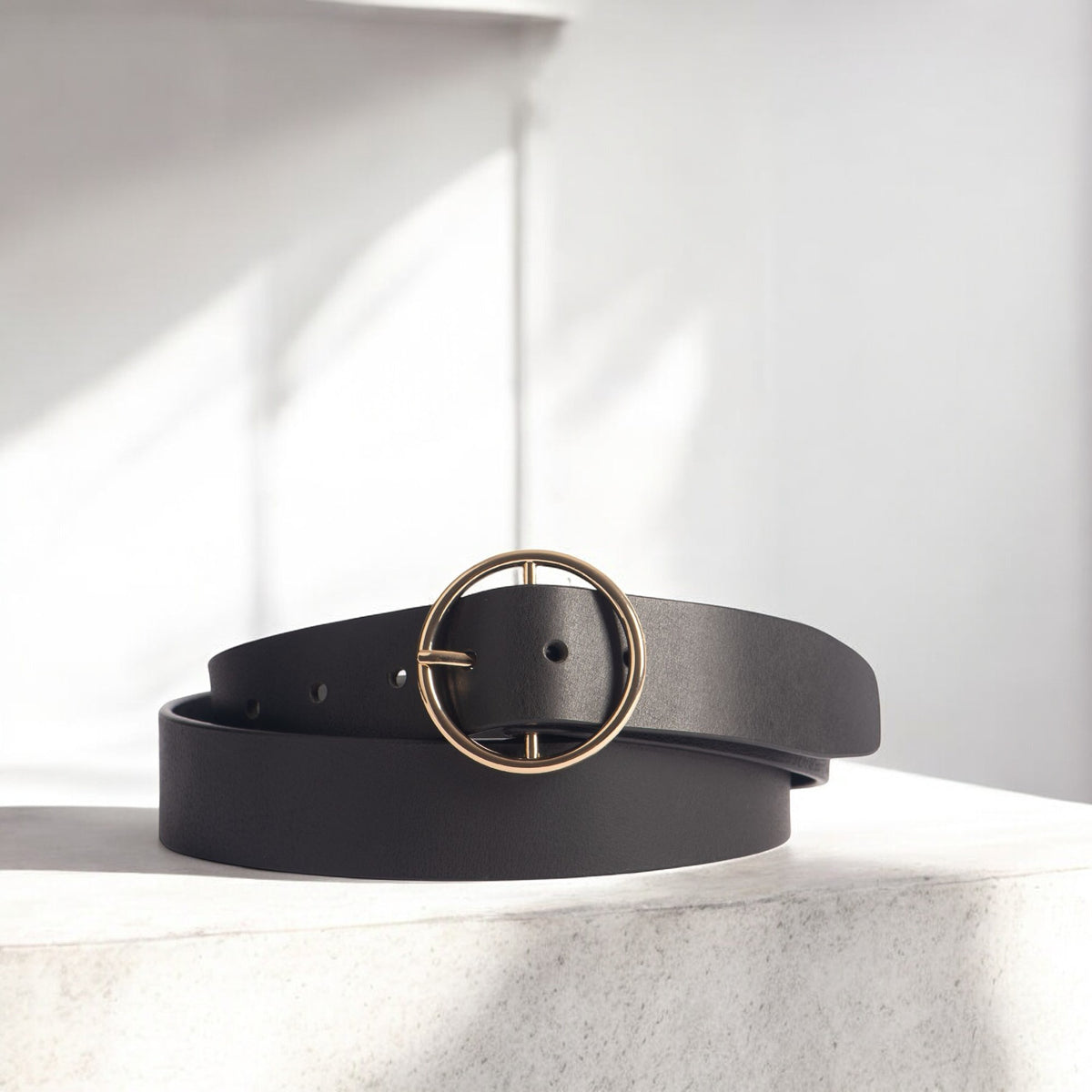 Orla black leather dress belt with large gold circle buckle