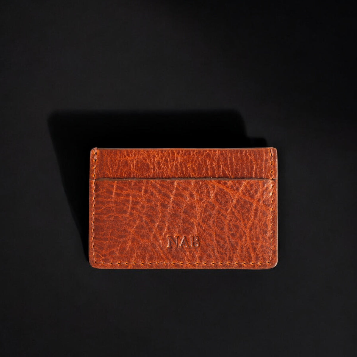 The Maverick pebble grain bison leather cardholder in cognac