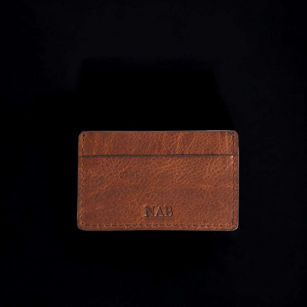 The Maverick pebble grain bison leather cardholder in brown