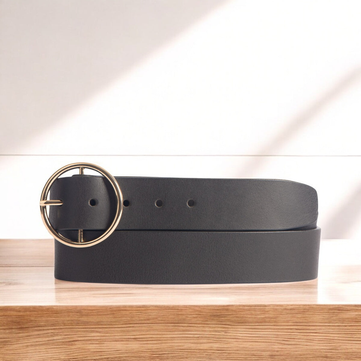 Orla black leather dress belt with large gold circle buckle