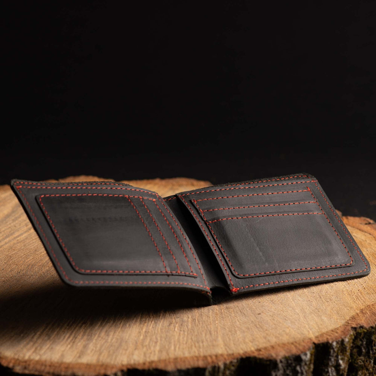 The Poseidon black full-grain leather wallet with blue stitching